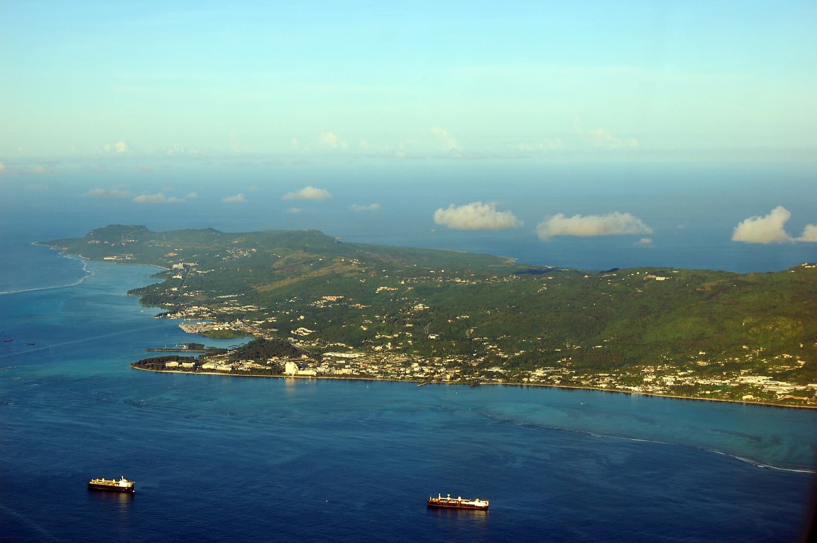 Aerial view of a reef-fringed coast in the Mariana Islands